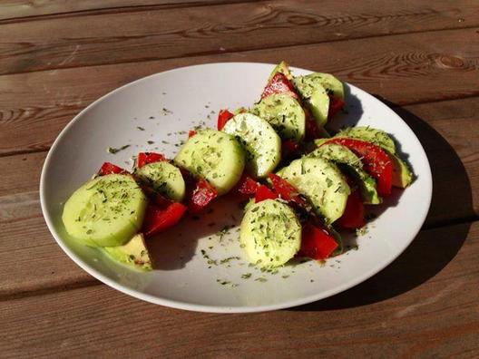 Cucumber, tomato and avocado slices with a bit of lemon juice and some Italian herbs