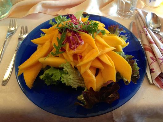 Mangoes on leafy greens