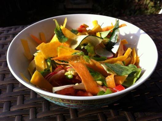 Corn salad, butternut, radish, carrot, zuchini with avocado and tomatoes massaged in