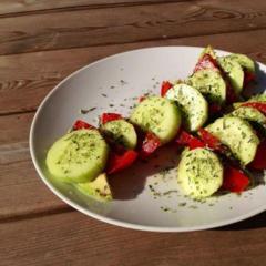 Cucumber, tomato and avocado slices with a bit of lemon juice and some Italian herbs