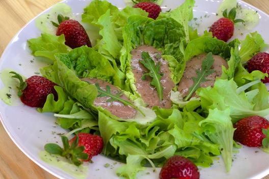 Banana - strawberry on leafy greens