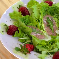 Banana - strawberry on leafy greens Banana - strawberry on leafy greens