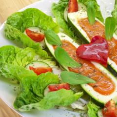 Banana - stuffed zucchini on leafy greens Banana - stuffed zucchini on leafy greens