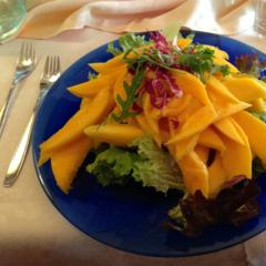 Mangoes on leafy greens