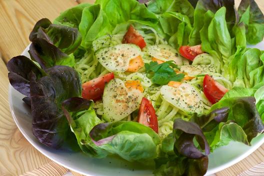 Pineapple - parsley - "pasta" on leafy greens