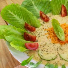 Pineapple - apple - soup with carrots on romaine lettuce 