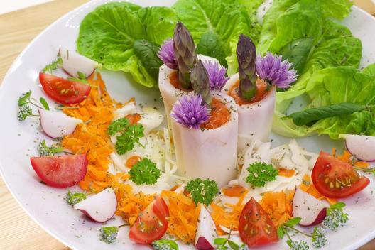 Radish towers with asparagus and chives blossoms