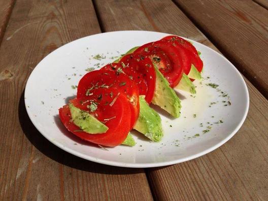 Simple tomato and avocado slices with some lemon juice and Italian herbs...