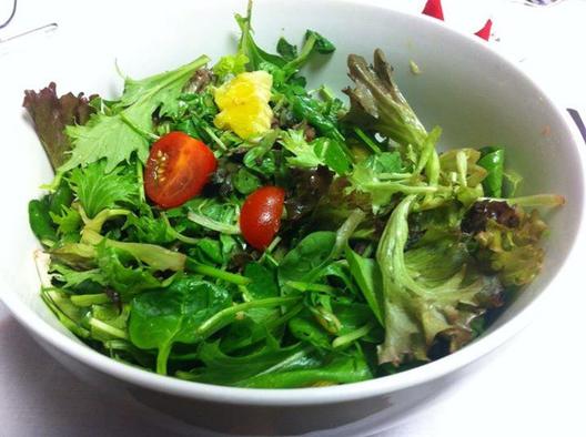 The salad I made for me for my company's Christmas celebration. Very yummy! A variation of tender greens with cocktail tomatoes, orange pieces and pine kernels.